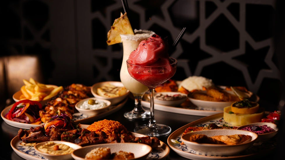 Hazine food Image for Menus section on home page with cocktail glass surrounded by food image